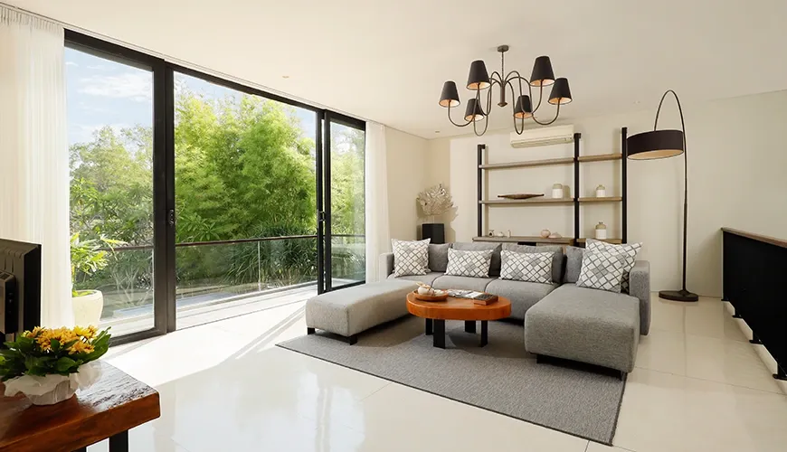 Modern living room with a tropical garden view at vinila villas